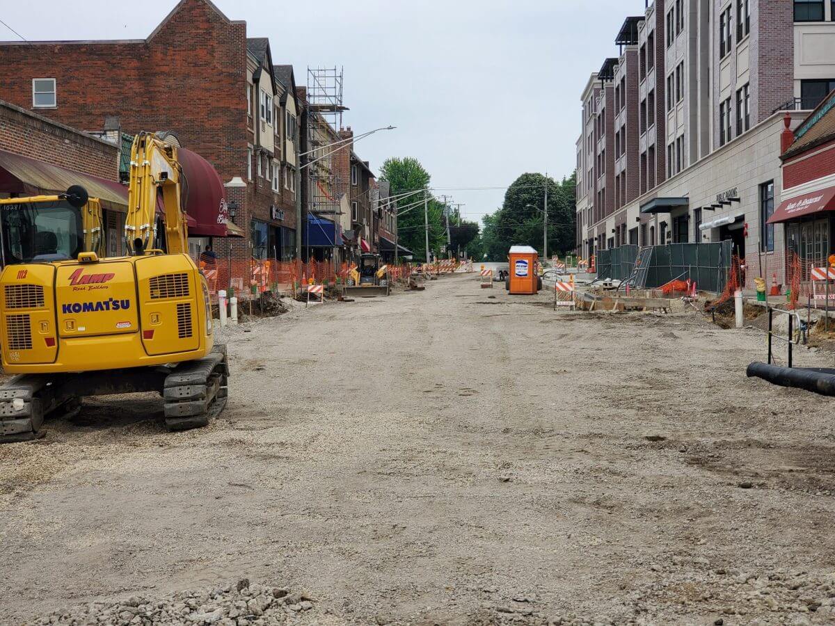Cold Milling Process and Roadway Construction in Downtown Area with ALAMP Vehicle in Foreground