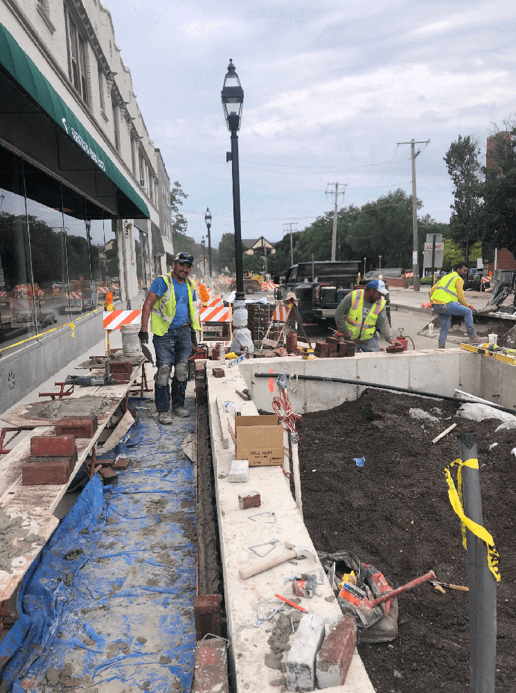 Concrete Construction of Brick Tree Planters in Downtown Area with ALAMP Crew Members Working